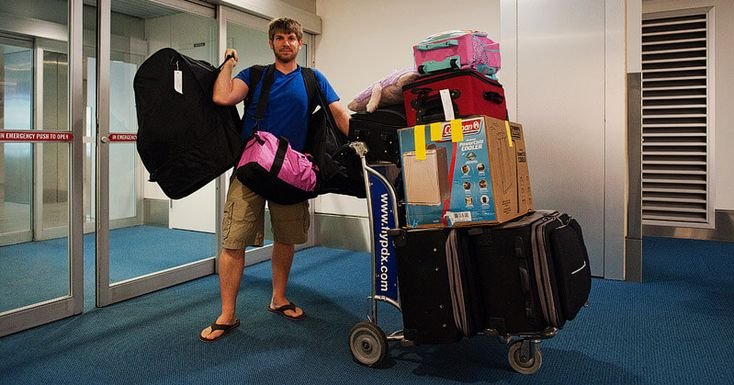 a traveler from Europe carrying a lot of items in a troly - luggage storage Bali to Gili 