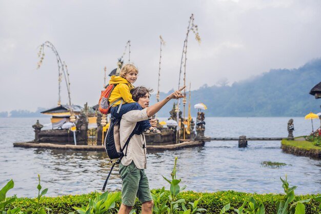 Bali Day Tours - photo of a father carrying his child in Bedugul, Bali