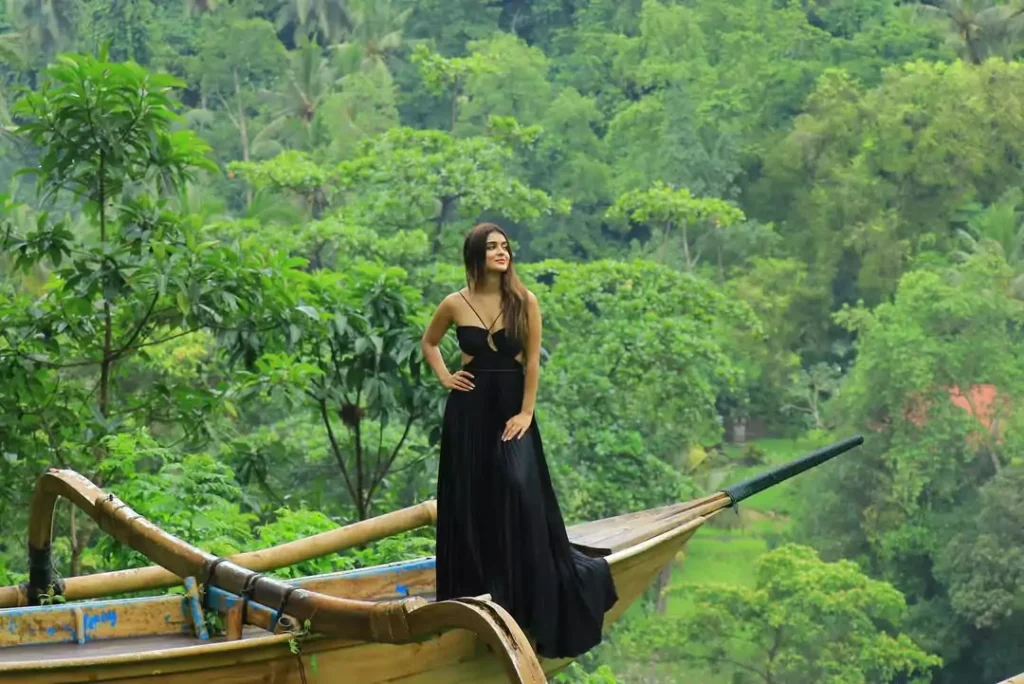 Photo of an Indian woman posing with the beautiful Ubud forest in the background