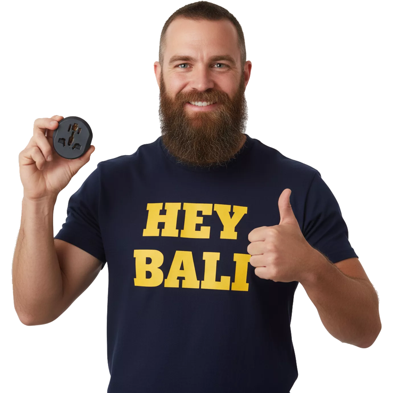 A male tourist from America with a long beard and bald head, wearing a dark blue T-shirt with yellow Hey Bali lettering, is showing off a free Bali adapter from Hey Bali.