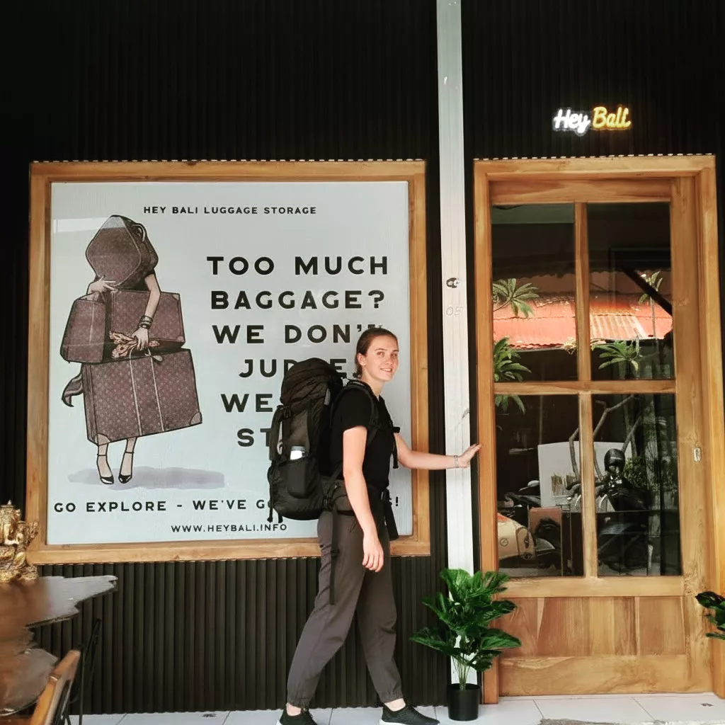 Photo of an American female tourist with a backpack arriving at Hey Bali to pick up a free Bali adapter