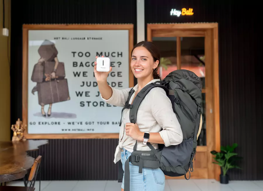 A photo of a happy Australian woman who received a free adapter from Hey Bali and took a photo in front of the Hey Bali office in Kuta, Bali.
