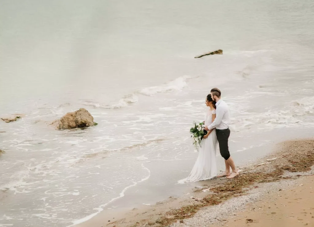 Photo of a foreign couple on a beach in Bali. Photo taken using a drone.