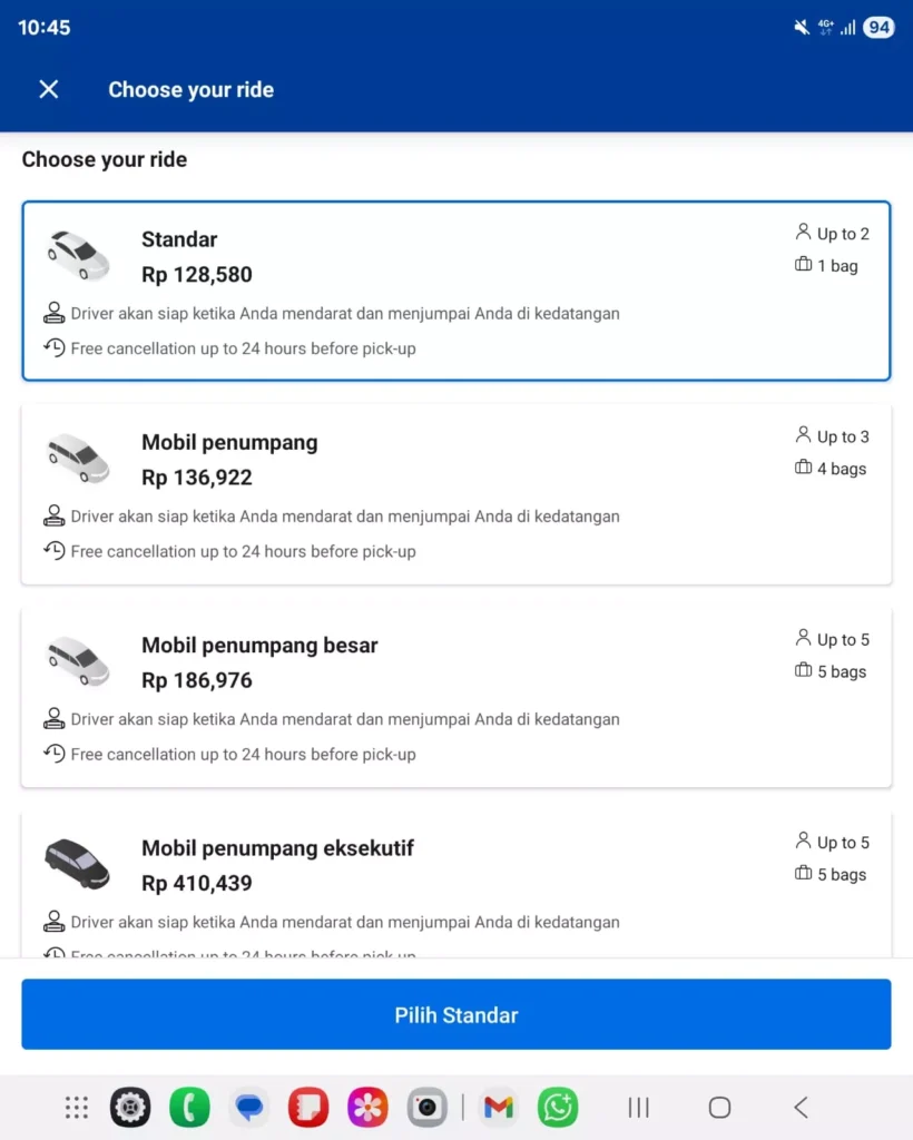"Screenshot of Booking.com transfer options answering How Much is a Taxi from Bali Airport to Kuta with Standard car Rp 128,580"
