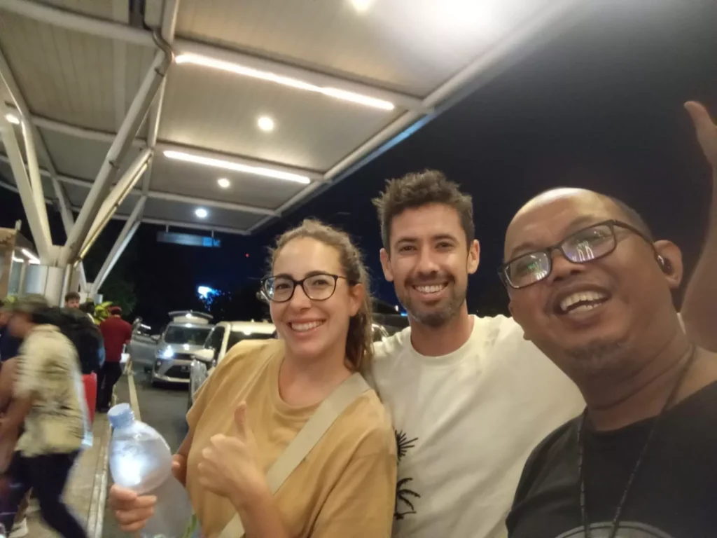 photo of a Hey Bali driver with two tourists at Bali airport