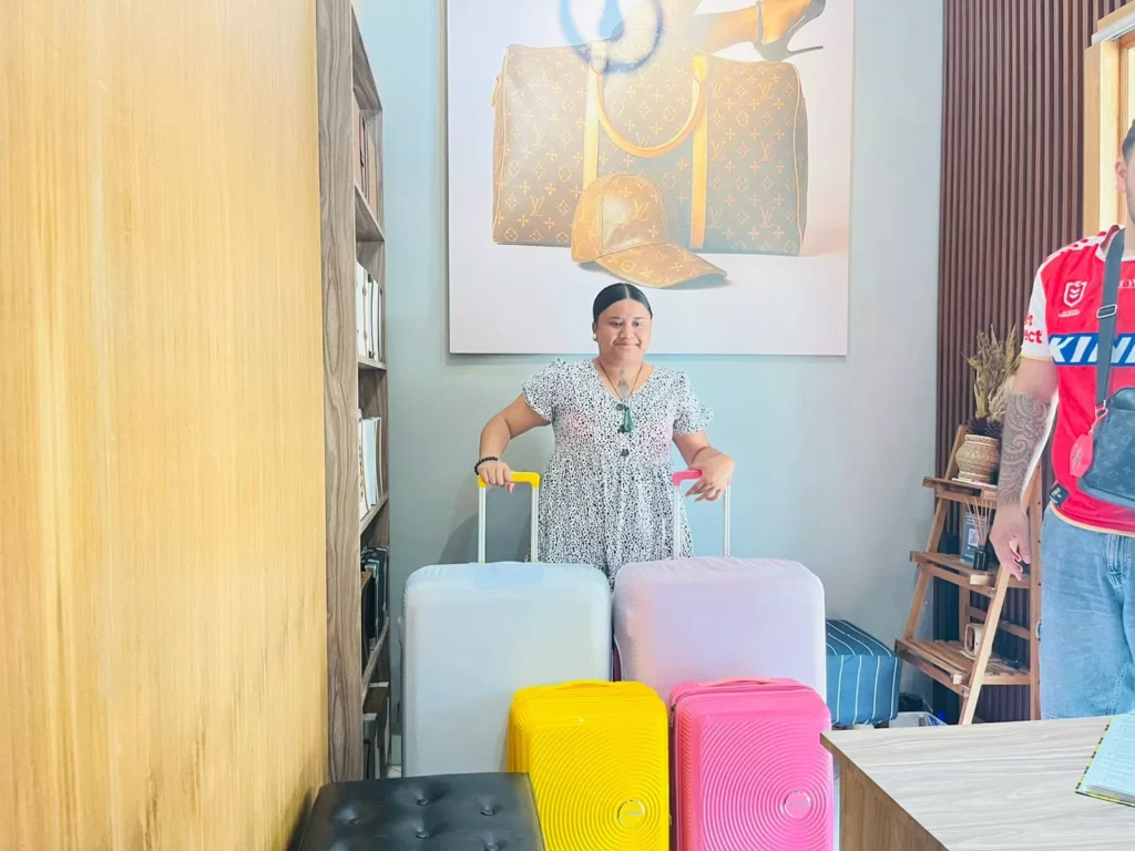 Hey Bali female guest with 4 suitcases using the Bali Transfer Luggage service Hey Bali